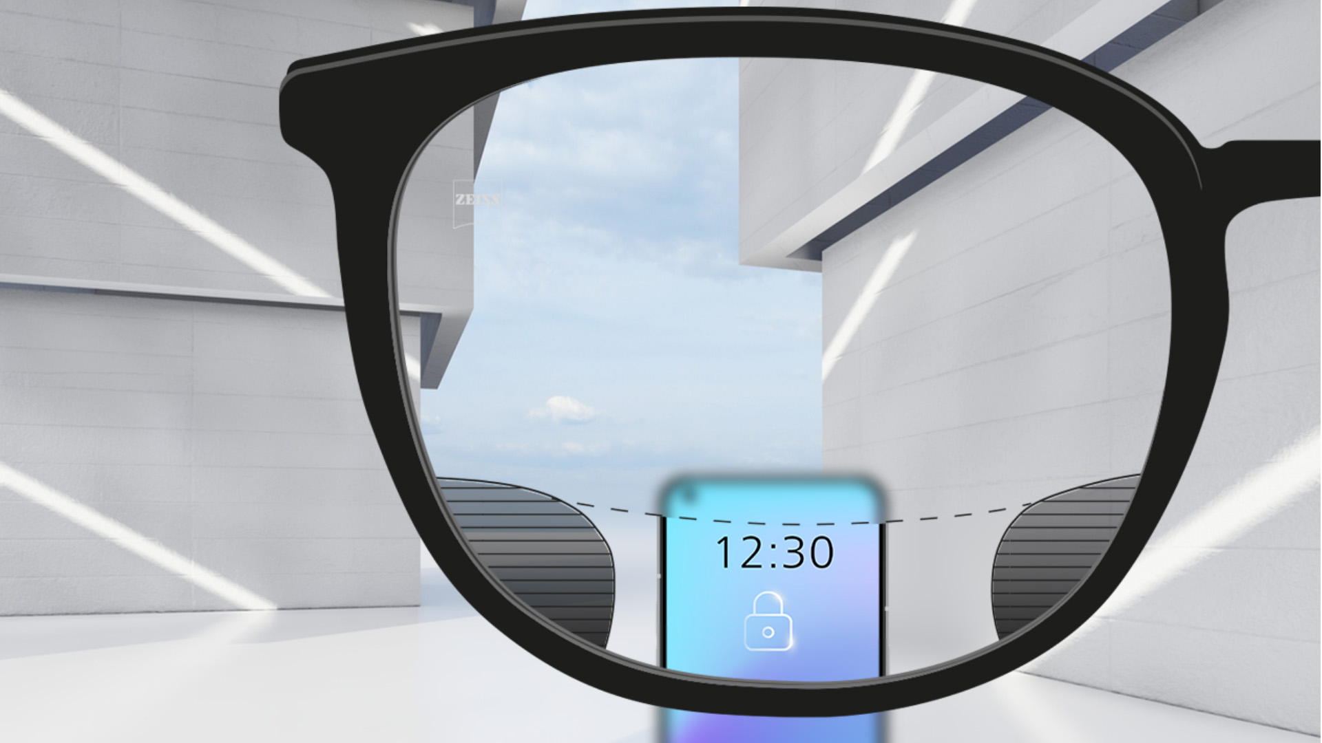 O imagine cu punct de vedere cu lentilele ZEISS Digital SmartLife, cu un smartphone și lentile complet incolore în partea superioară și inferioară a lentilelor și cu mici părți neclare la stânga și la dreapta.